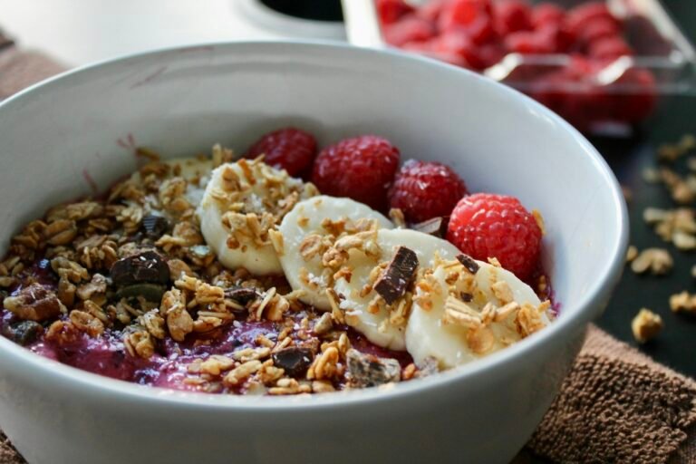 Healthy gut foods for breakfast including oatmeal banana yogurt chia seeds and herbal tea